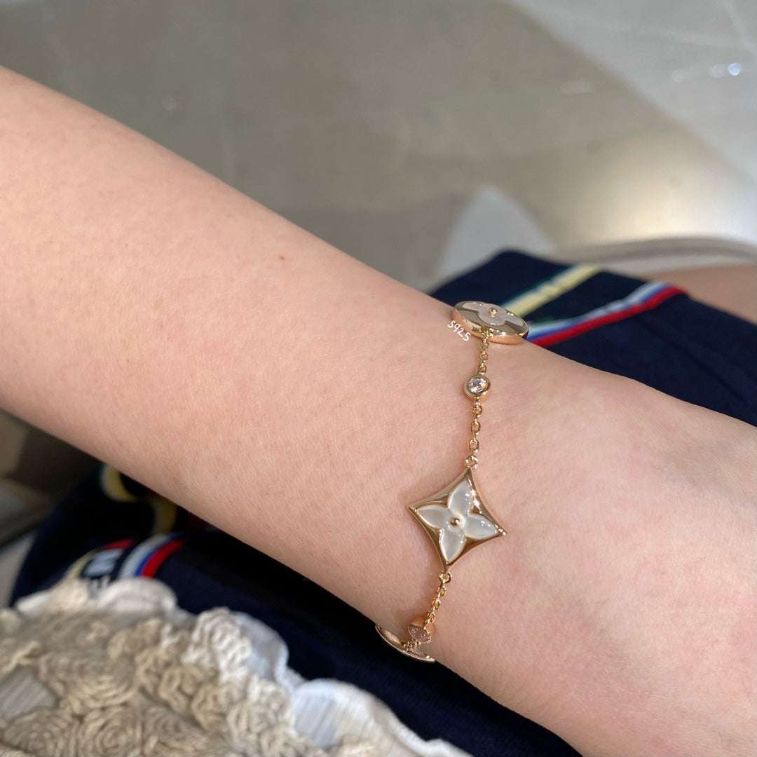 [TRENDS]STAR AND SUN 4 MOTIF WHITE MOP PINK GOLD BRACELET