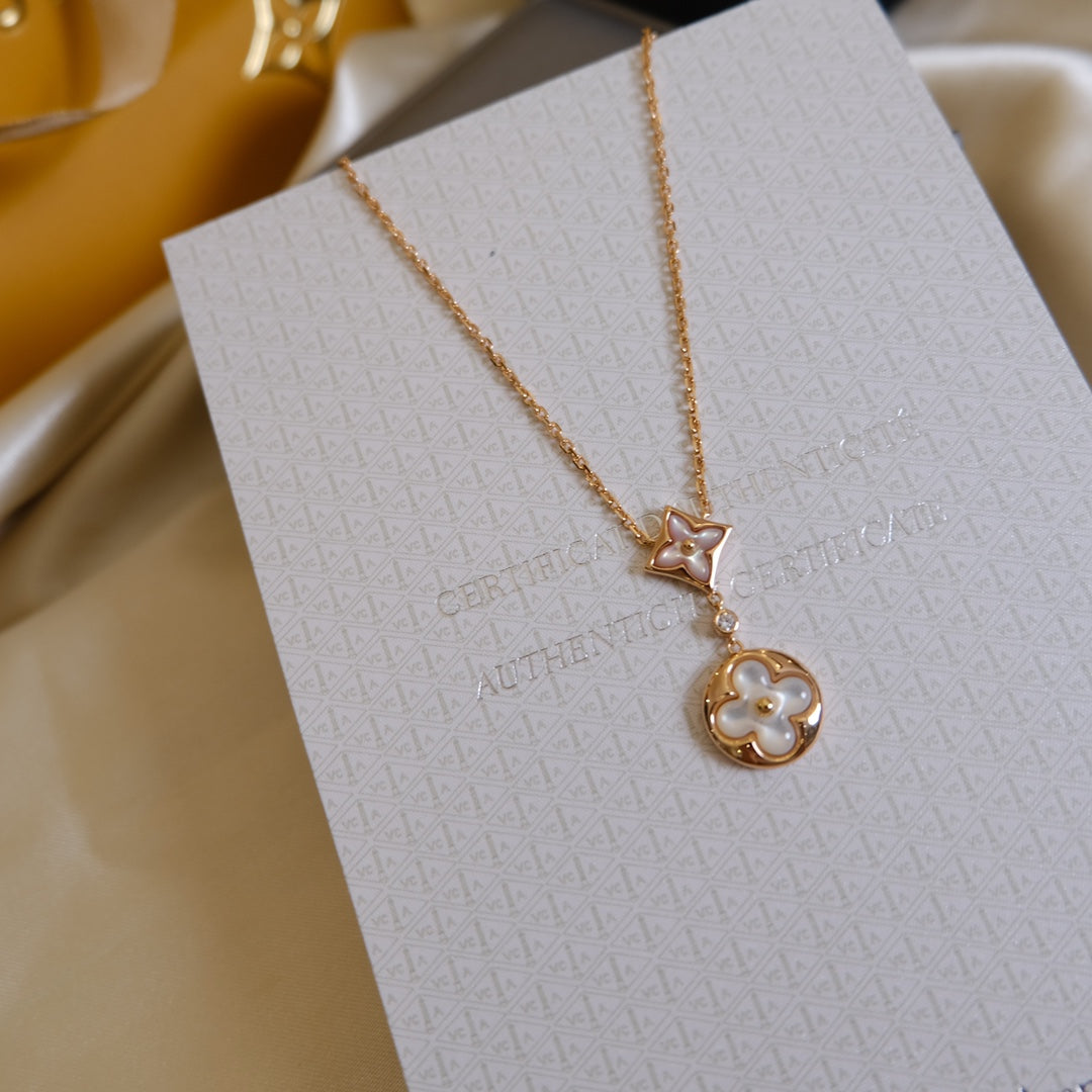 [TENDANCES] COLLIER OR ROSE À 2 MOTIFS ÉTOILE ET SOLEIL NACRE BLANCHE 